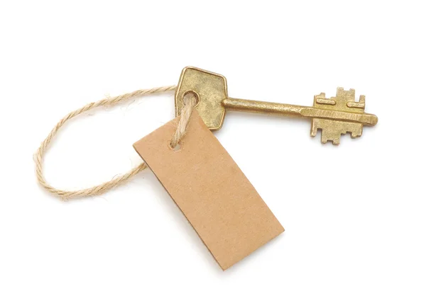 Old key and blank label for your text message — Stock Photo, Image