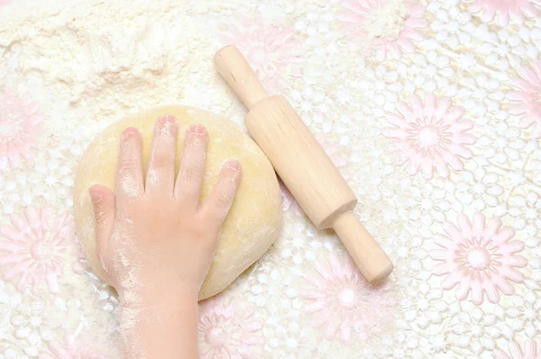 stock image Child's hands kneading dough