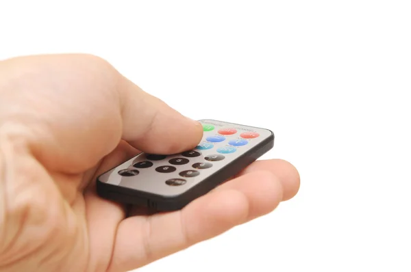 Remote control in hand on white — Stock Photo, Image