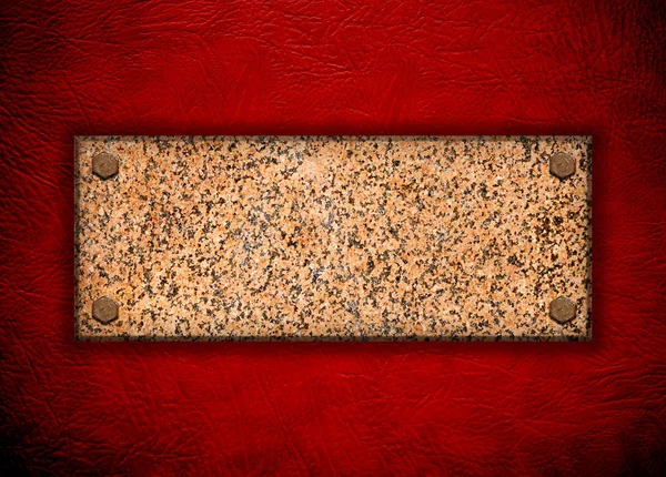 Granite stone on red wall — Stock Photo, Image