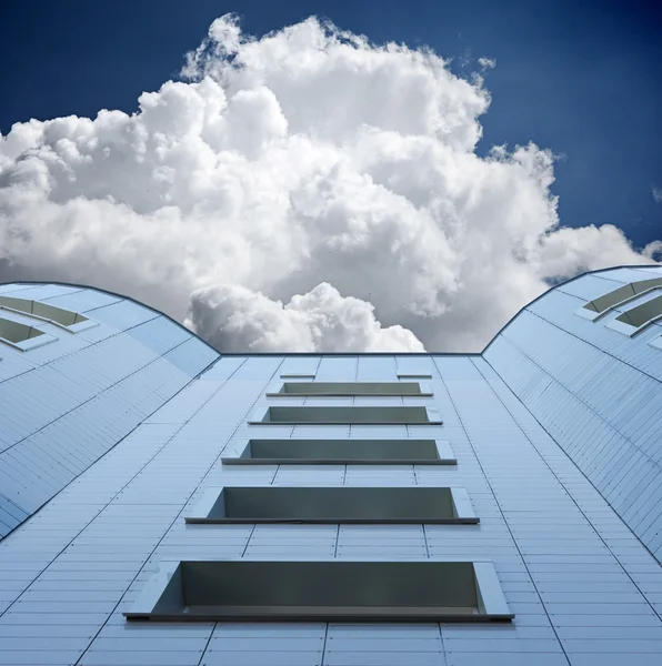 stock image Modern office building growing into the sky