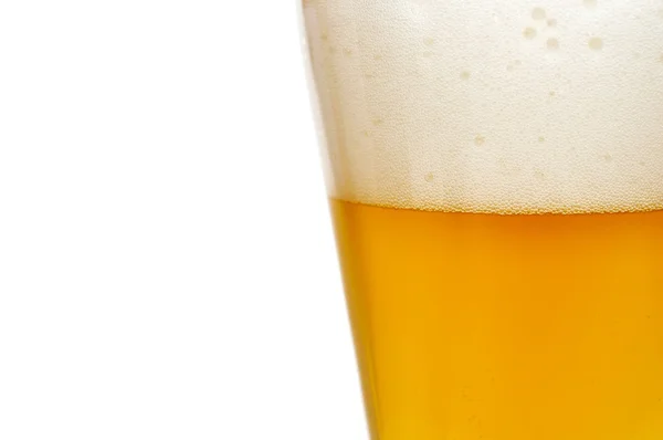 Glas bier close-up met schuim — Stockfoto