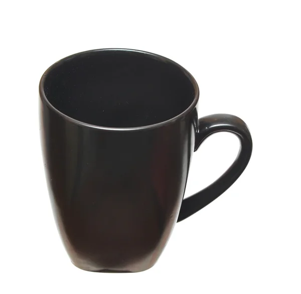 Schwarze Tasse auf weißem Hintergrund — Stockfoto