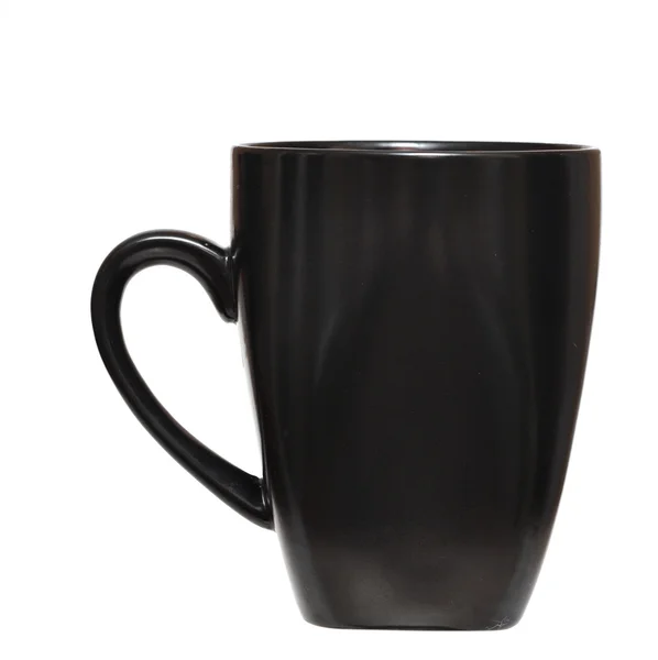Schwarze Tasse auf weißem Hintergrund — Stockfoto