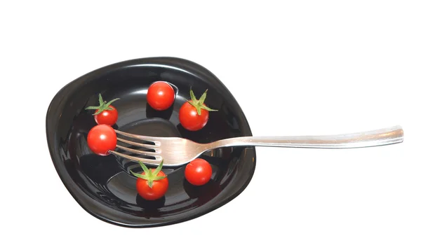 Pomodori sul piatto nero — Foto Stock