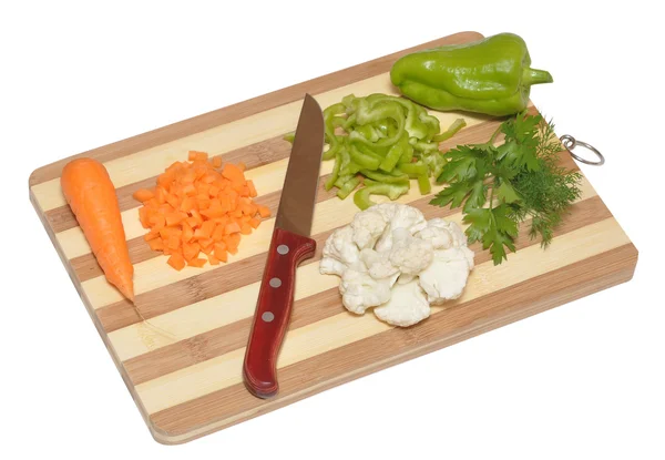 Zátiší zeleniny a kuchyňského nože na řezací desce — Stock fotografie
