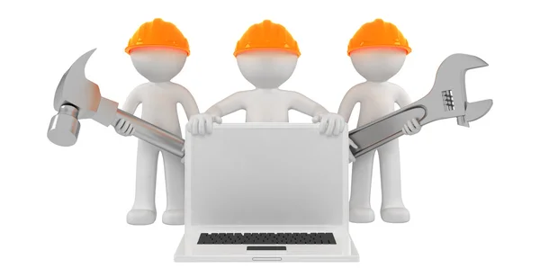 Construtores com laptop e ferramentas — Fotografia de Stock