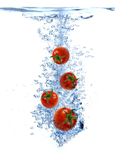Spruzzi di frutta nell'acqua — Foto Stock