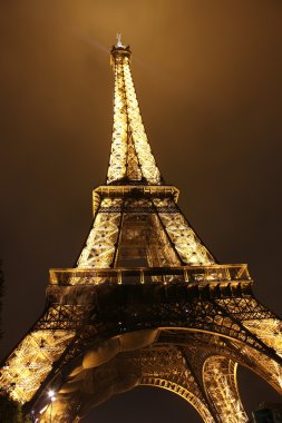 Illuminated Eiffel tower at night clipart