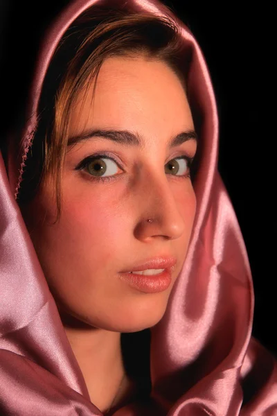 stock image A portrait of a young arabic woman in red satin