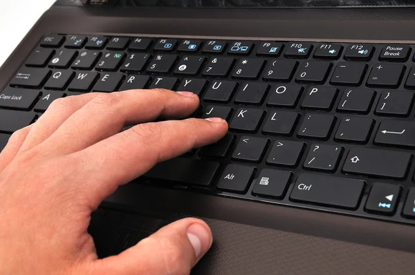 Hand on a laptop — Stock Photo, Image