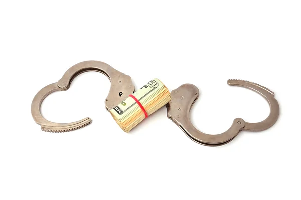 Handcuffs and dollars — Stock Photo, Image