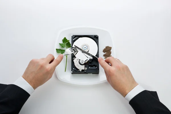 Hard disk cut with a knife man — Stock Photo, Image