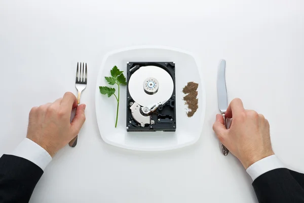 Hard drive is on a plate — Stock Photo, Image