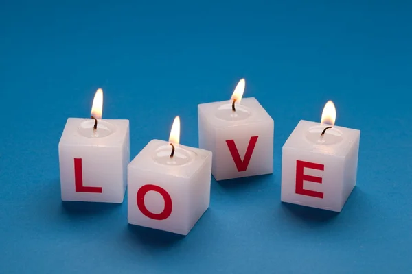 "love "printed on candles . — стоковое фото