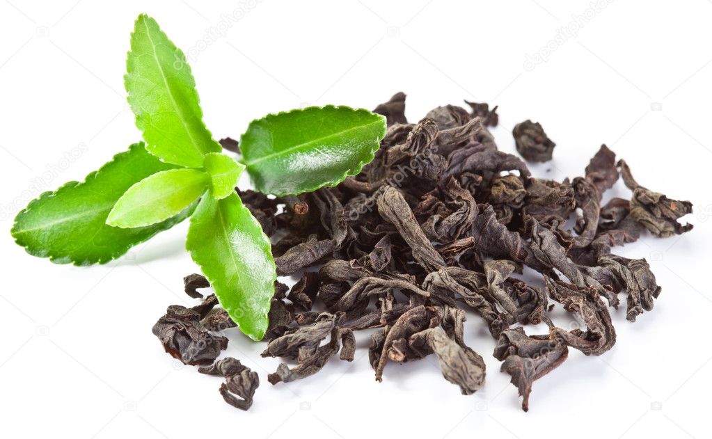 Heap of dry tea with green tea leaves.