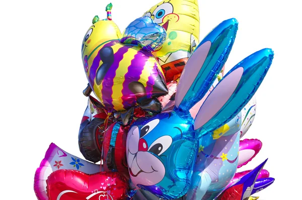 Palloncini volanti in forma di giocattoli isolati su sfondo cielo blu — Foto Stock