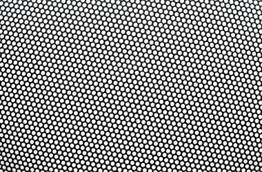 Black metal lattice with round apertures on white background. Cl