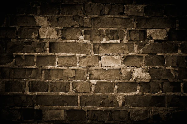 Τοίχο από ακατέργαστων τούβλα, τονισμένα. — Stockfoto
