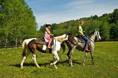 Girls Riding Horses clipart