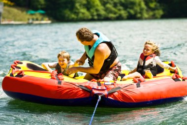 Family Fun Tubing on a Lake clipart