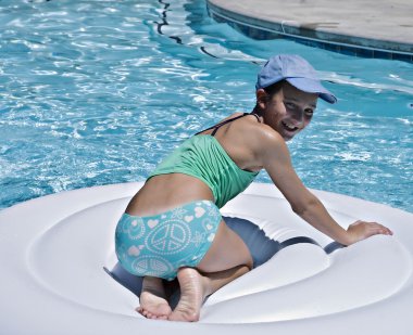 Young Girl Playing in Pool clipart