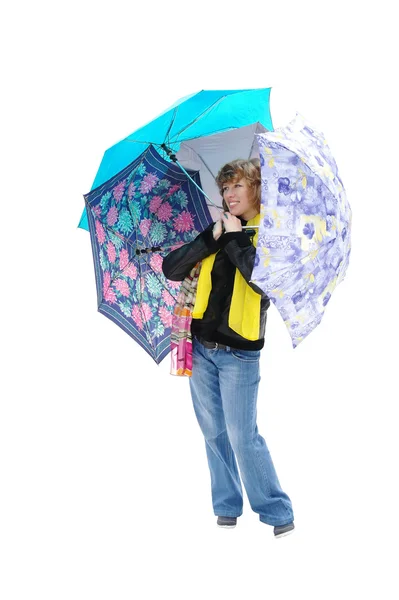 The girl in spring clothes with umbrellas, it is isolated — Stock Photo, Image