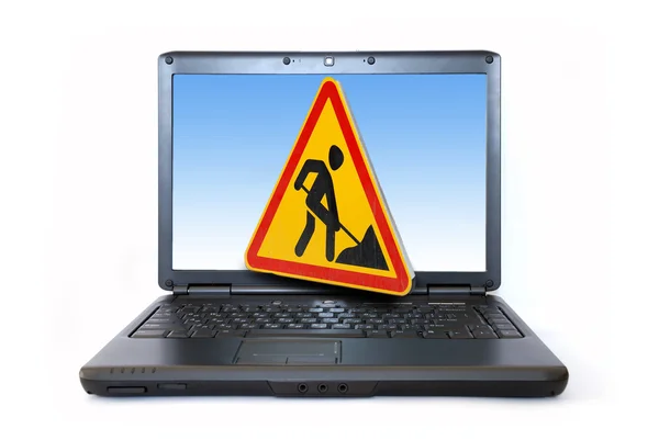 Waarschuwing in aanbouw op monitor van laptop — Stockfoto