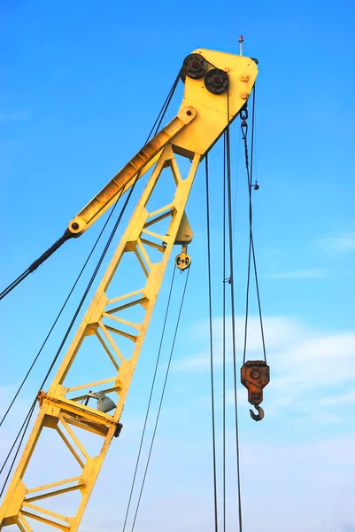 Crane on blue sky background — Stock Photo, Image