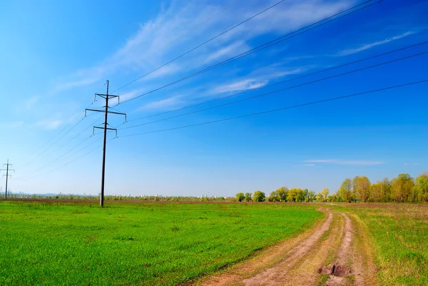 stock image High voltage tower in field