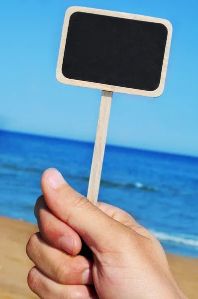 Etiqueta de pizarra en la playa —  Fotos de Stock