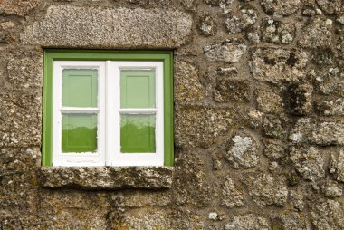 Green window of an old house clipart