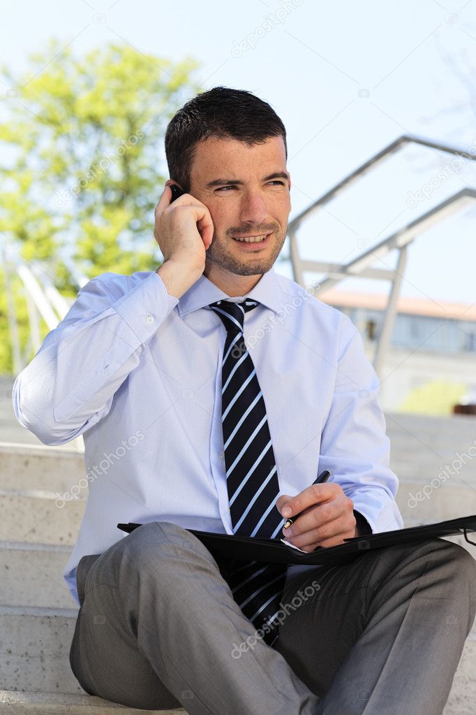 Businessman on the phone outdoor