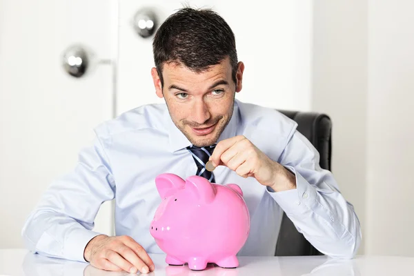 Coin in piggy bang — Stock Photo, Image