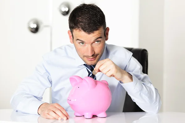 Coin in piggy — Stock Photo, Image