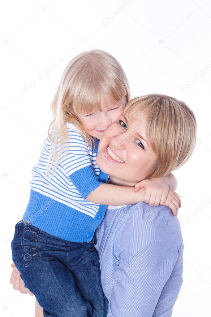 Happy smiling mom and child embracing