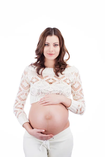 Kobieta w ciąży szczęśliwy trzymać jej brzuch rękami — Zdjęcie stockowe