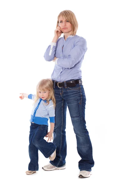 Playful child disturb mother to talk on cell — Stock Photo, Image