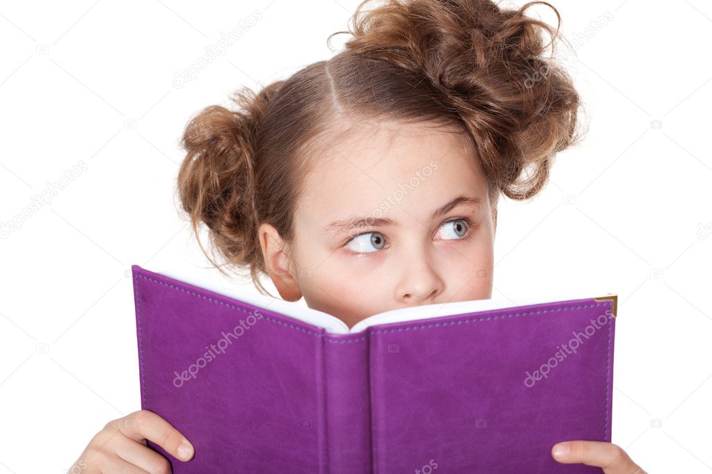 Curious girl peep behind the book