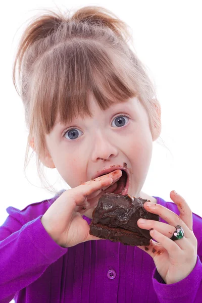 Hungry funny girl lick fingers dirty with tasty cake — Stock Photo, Image
