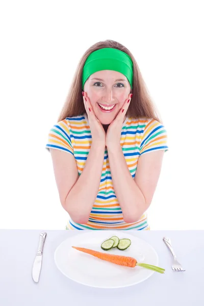 Verrast lachende vrouw eet wortel en sla — Stockfoto