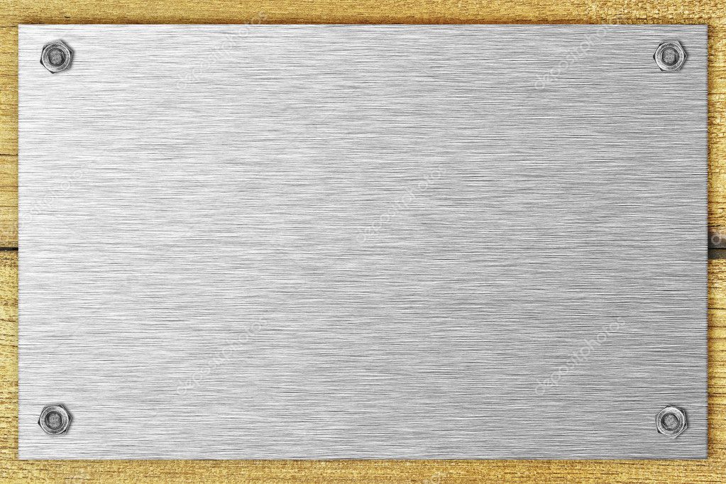 Blank steel plate bolted to a wooden surface — Stock Photo © vladmoses ...