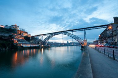 Dom Luis I Bridge illuminated at night. Oporto, Portugal wester clipart