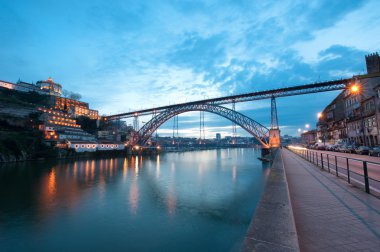 Dom Luis I Bridge illuminated at night. Oporto, Portugal clipart