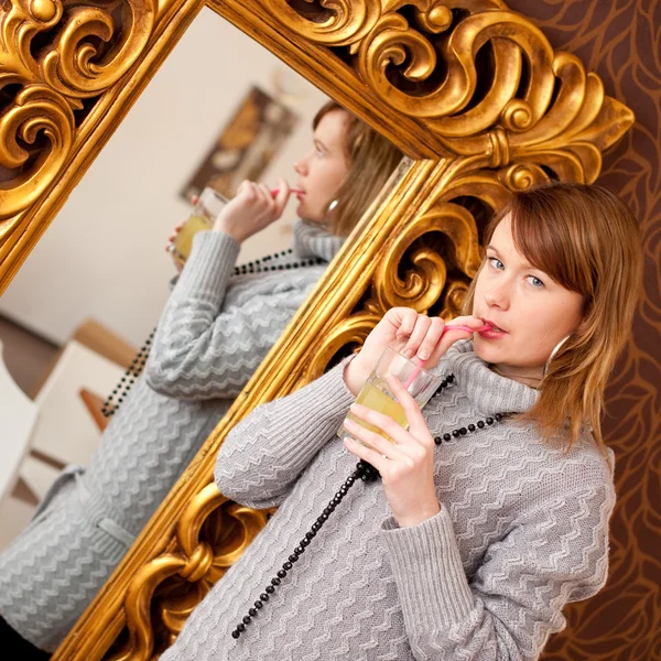 Beautiful girl infront of a mirror — Stock Photo, Image