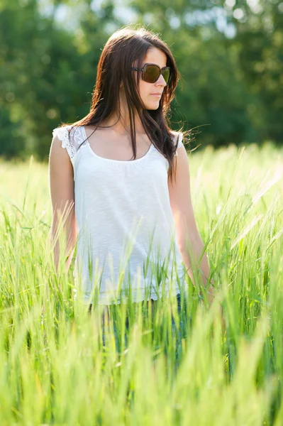 Attractive young woman on grain field — Stock Photo, Image