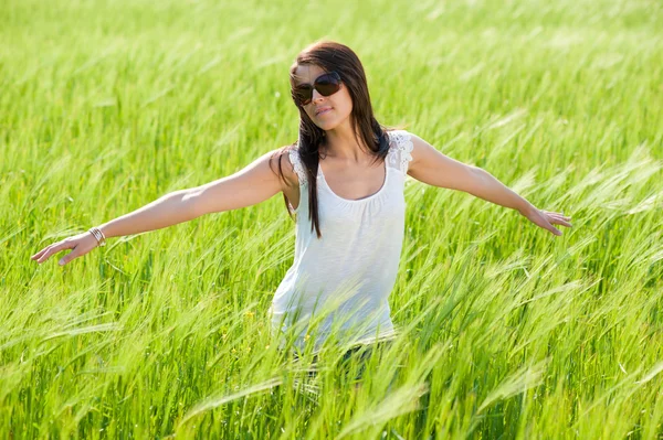 Attractive young woman on grain field — Stock Photo, Image
