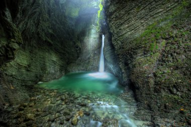 Kozjak waterfall - 15m high cascade in cave in alps in western Slovenia - central europe clipart