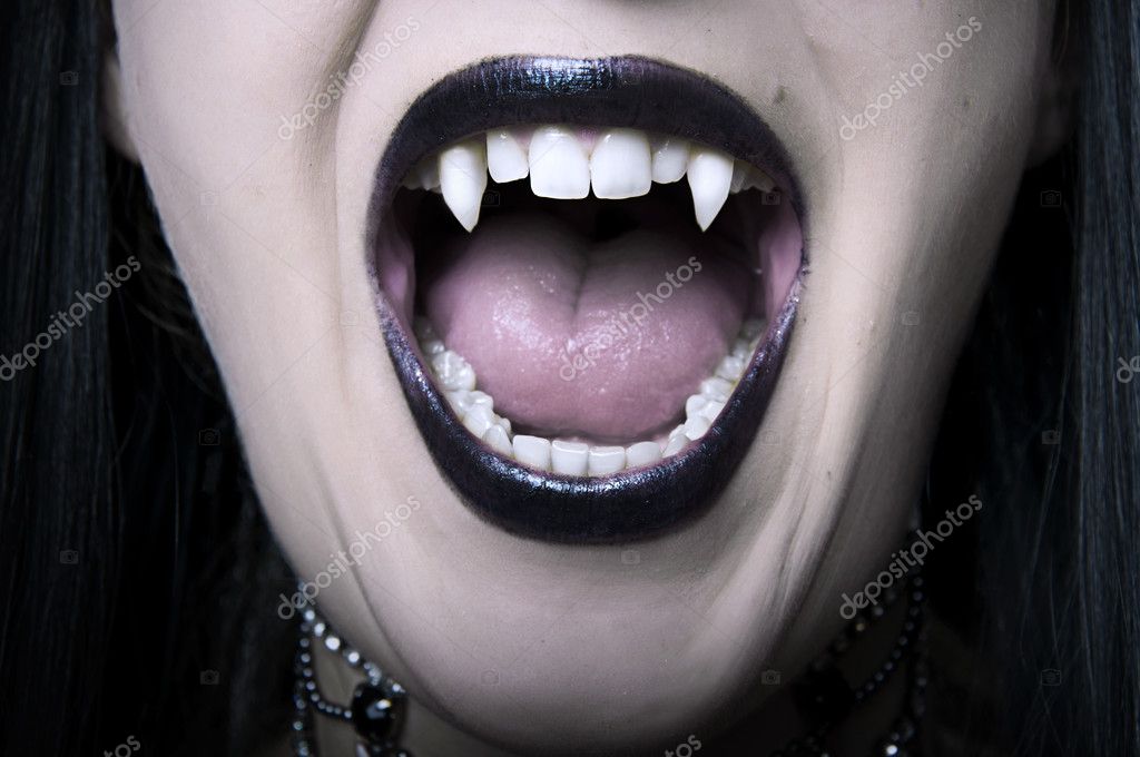 Opened vampire woman mouth closeup — Stock Photo © katalinks #6480139