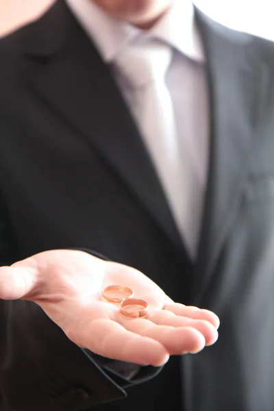 stock image Wedding rings in groom's hands